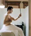 Zed Nelson, Image: Christopher, 22, Chest wax. J. Sister’s salon, New York, USA, From the series ‘Love Me’ by Zed Nelson, exposition Picture Perfect, BOZAR, Bruxelles, 2026, (c) courtesy the artist, Boombartstic Art Magazine